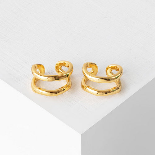 Irregular ear bone clips plated with real gold and studded with diamonds
