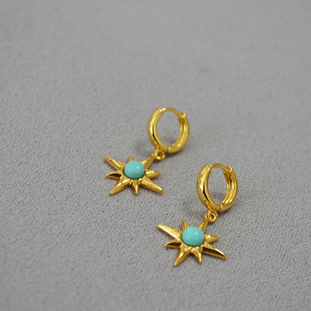 Octagonal star inlaid with turquoise and gilded brass ear buckles