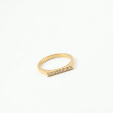Load image into Gallery viewer, A golden stainless steel D-shaped ring set with fine diamonds