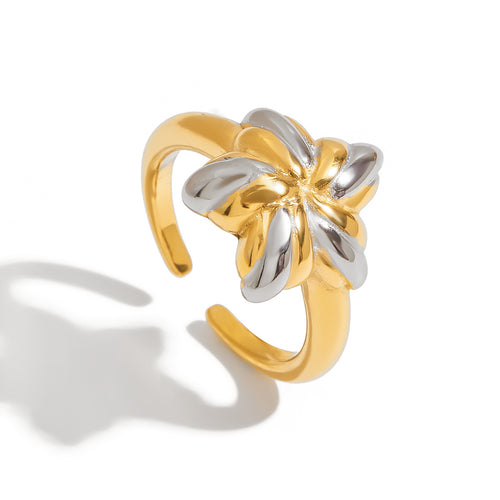 An 18K gold, stainless steel, gold and silver color-matched five-pointed star opening ring