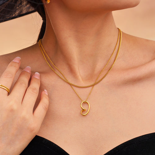 Stainless steel perforated heart-shaped pendant necklace