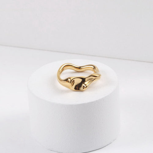A golden stainless steel design abstract irregular-shaped ring