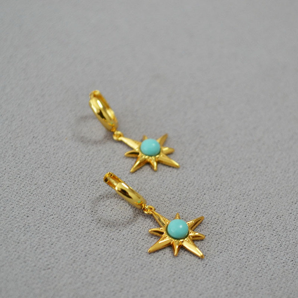 Octagonal star inlaid with turquoise and gilded brass ear buckles