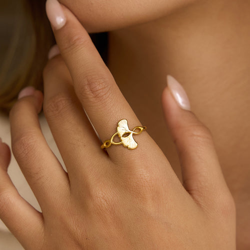 A stainless steel electroplated 18K gold line wound with ginkgo leaf adjustable opening ring