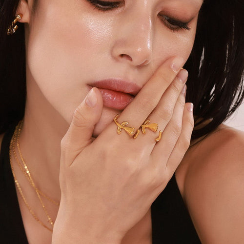 A golden stainless steel three-dimensional rose flower opening ring