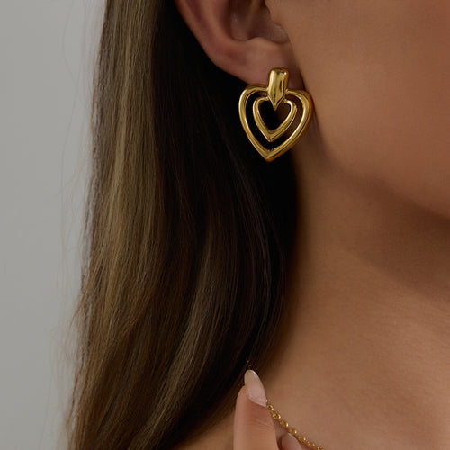 Golden stainless steel heart-shaped perforated earrings