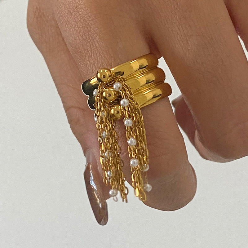 A golden stainless steel tassel open ring