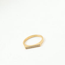Load image into Gallery viewer, A golden stainless steel D-shaped ring set with fine diamonds