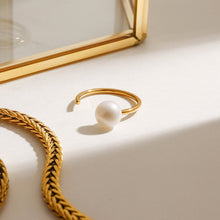 Load image into Gallery viewer, A stainless steel ring set with pearls