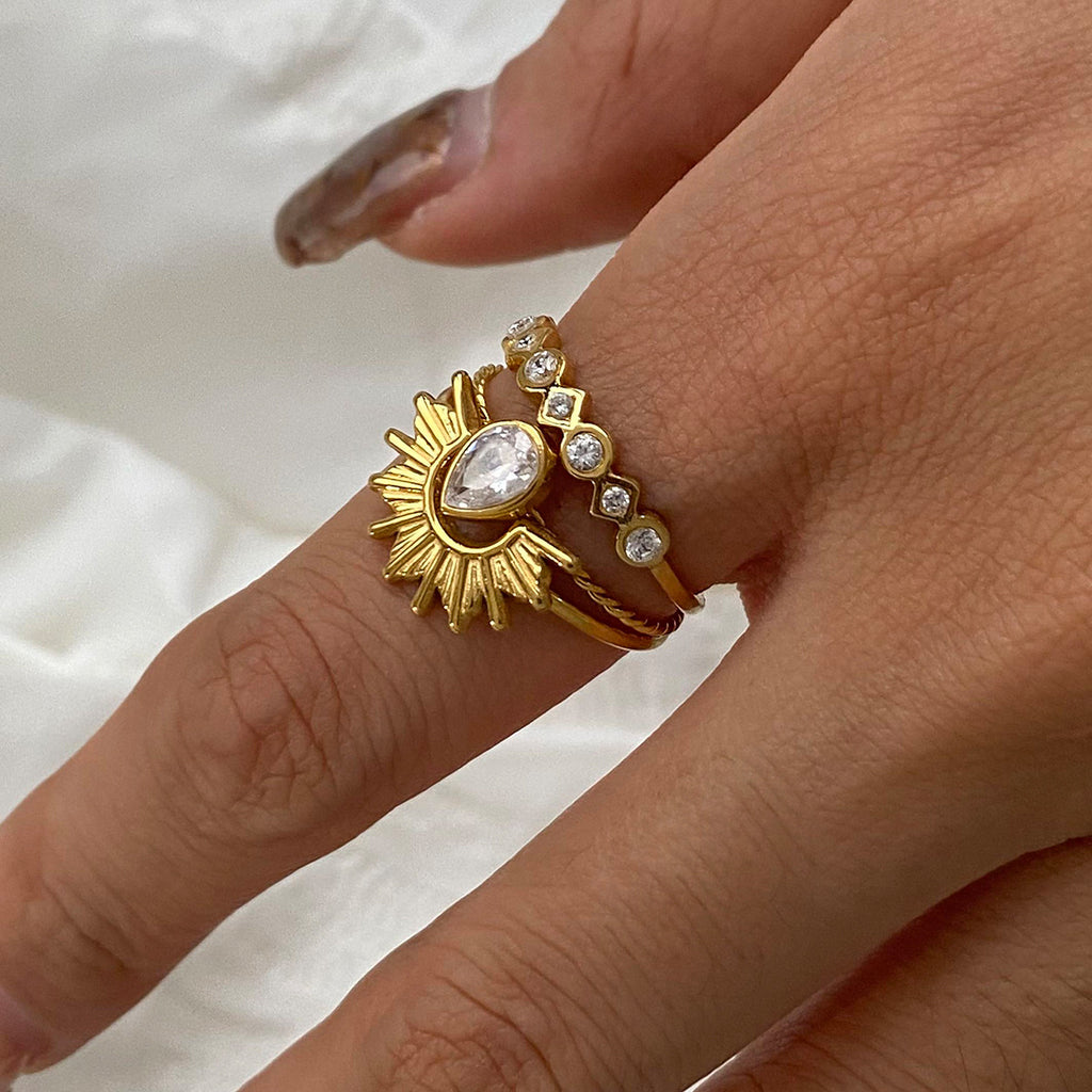A three-piece set of stainless steel zirconium-encrusted rings that can be stacked