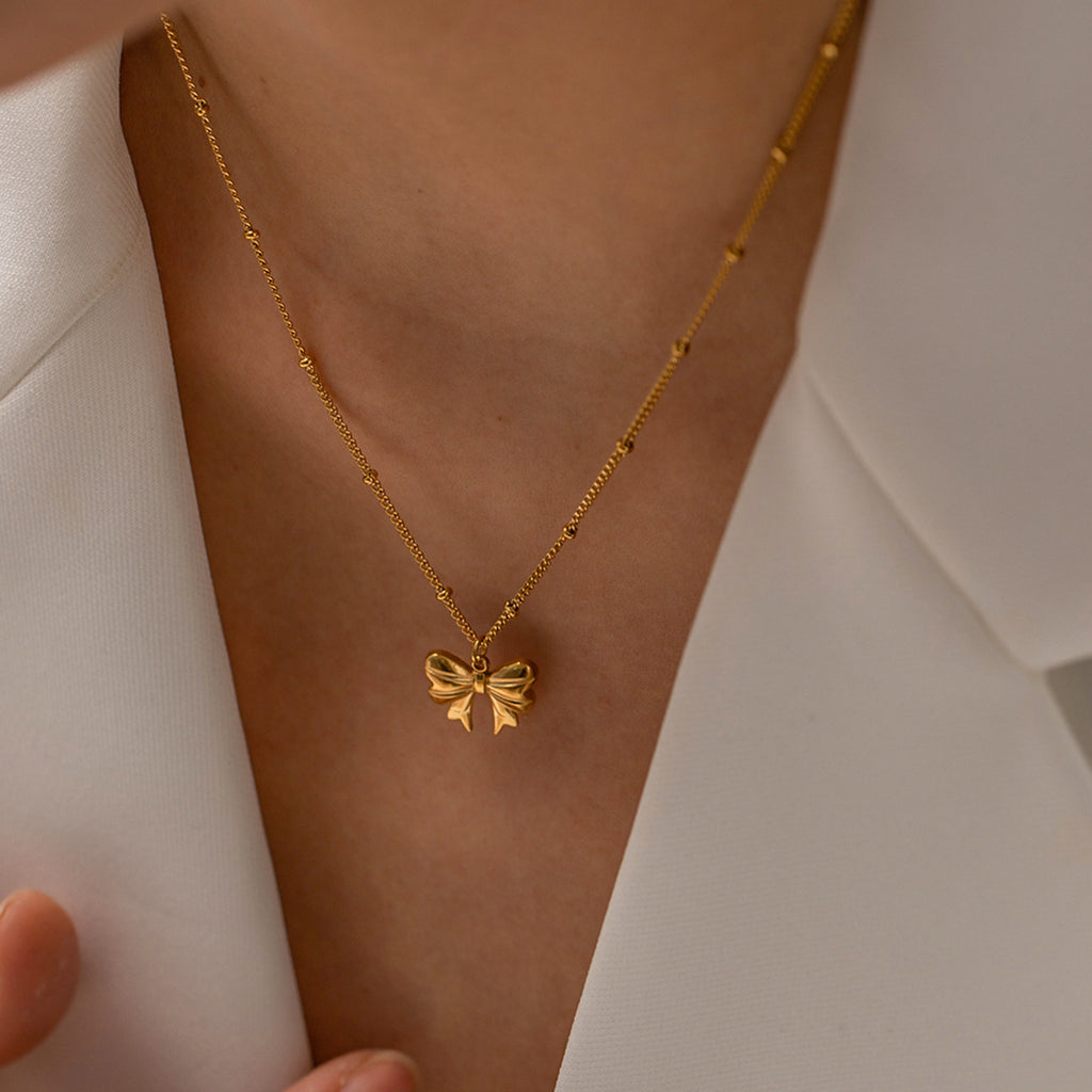 Stainless steel bow pendant necklace