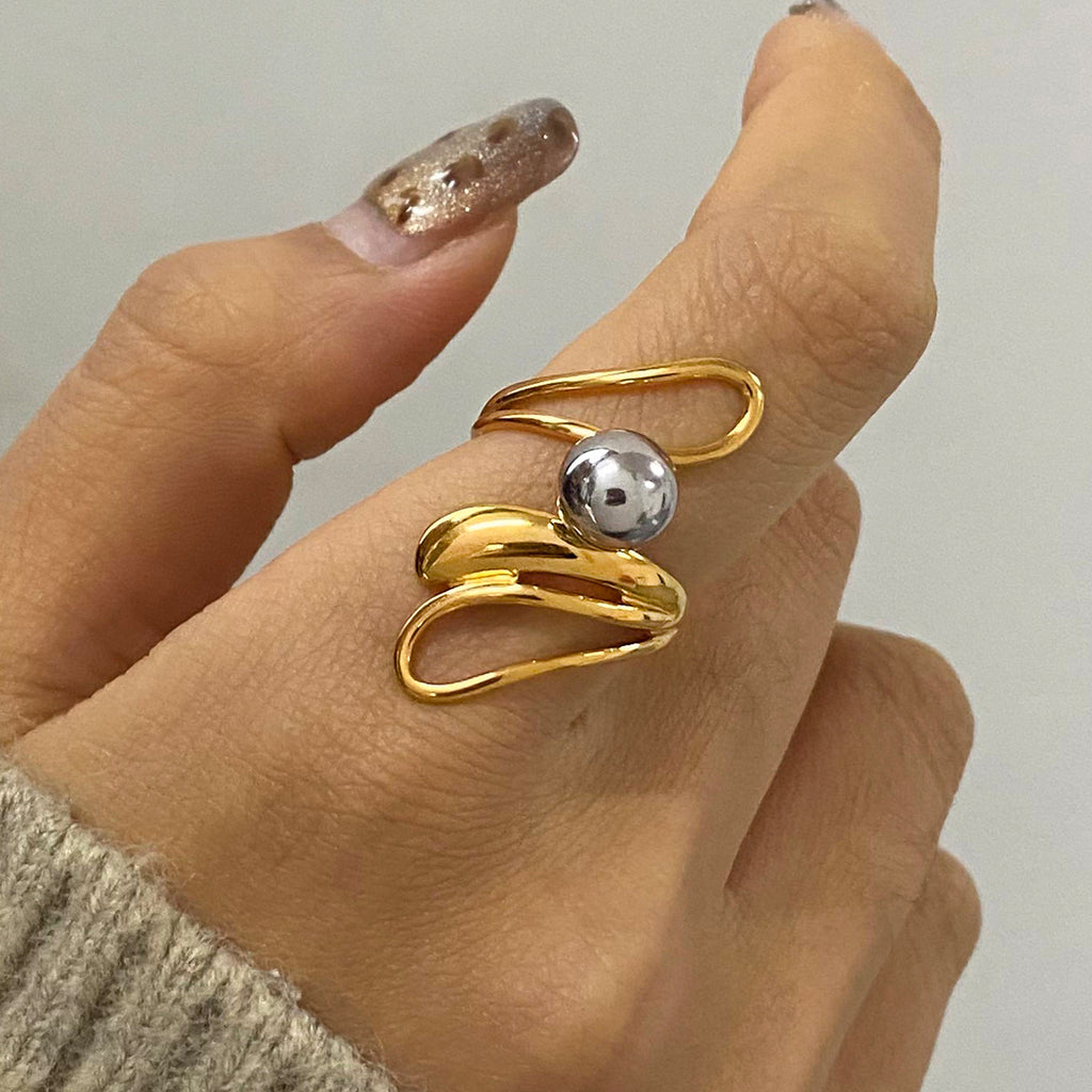 Stainless steel gold and silver color-matched irregular hollowed-out steel ball ring