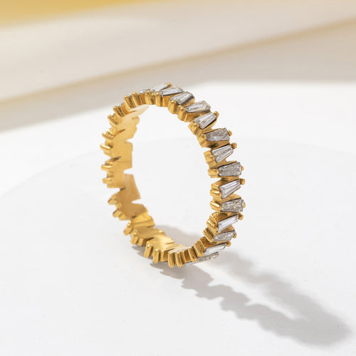 A golden stainless steel ring set with zirconium