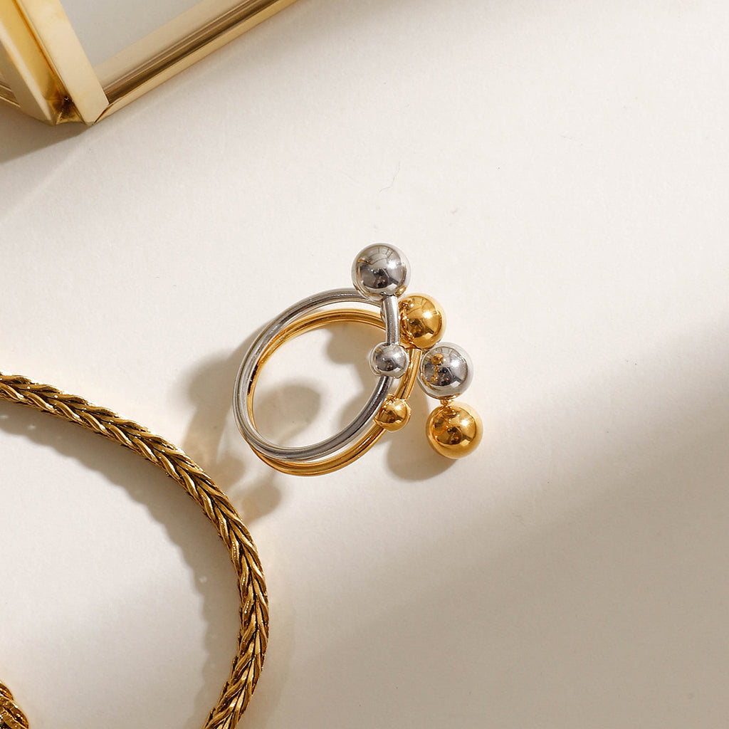A double-layer ring made of stainless steel, gold and silver, with large and small steel balls