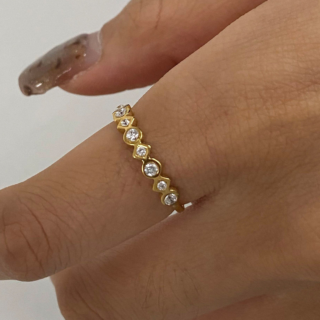 A three-piece set of stainless steel zirconium-encrusted rings that can be stacked