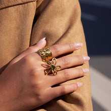 Load image into Gallery viewer, A golden stainless steel wide-face flower ring