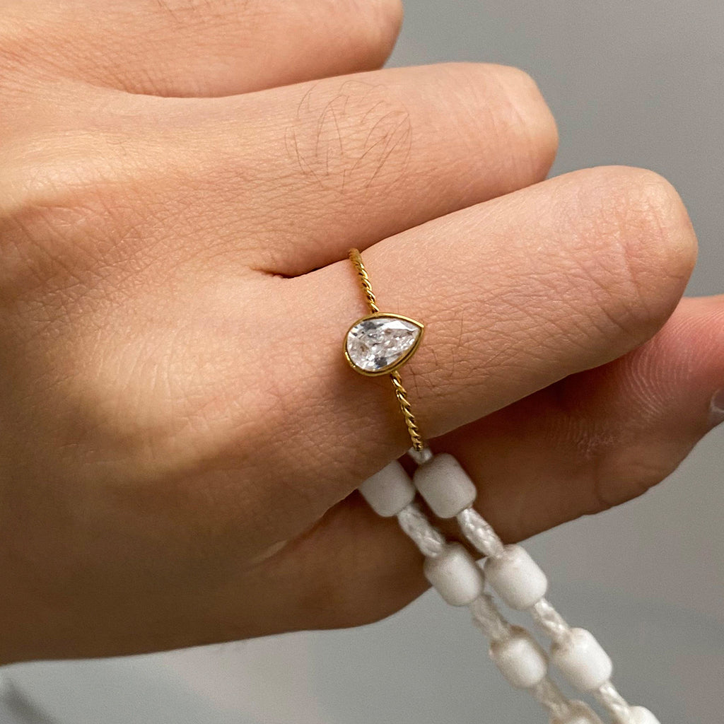 A three-piece set of stainless steel zirconium-encrusted rings that can be stacked