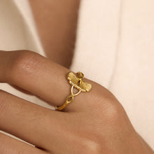 Load image into Gallery viewer, A stainless steel electroplated 18K gold line wound with ginkgo leaf adjustable opening ring