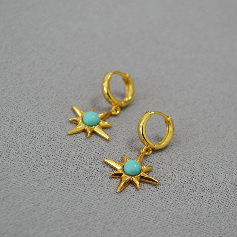Octagonal star inlaid with turquoise and gilded brass ear buckles