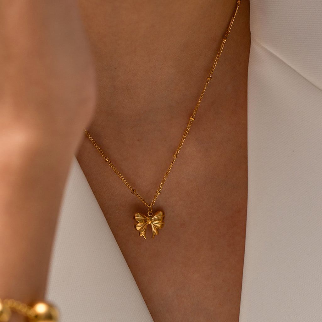 Stainless steel bow pendant necklace