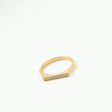 Load image into Gallery viewer, A golden stainless steel D-shaped ring set with fine diamonds