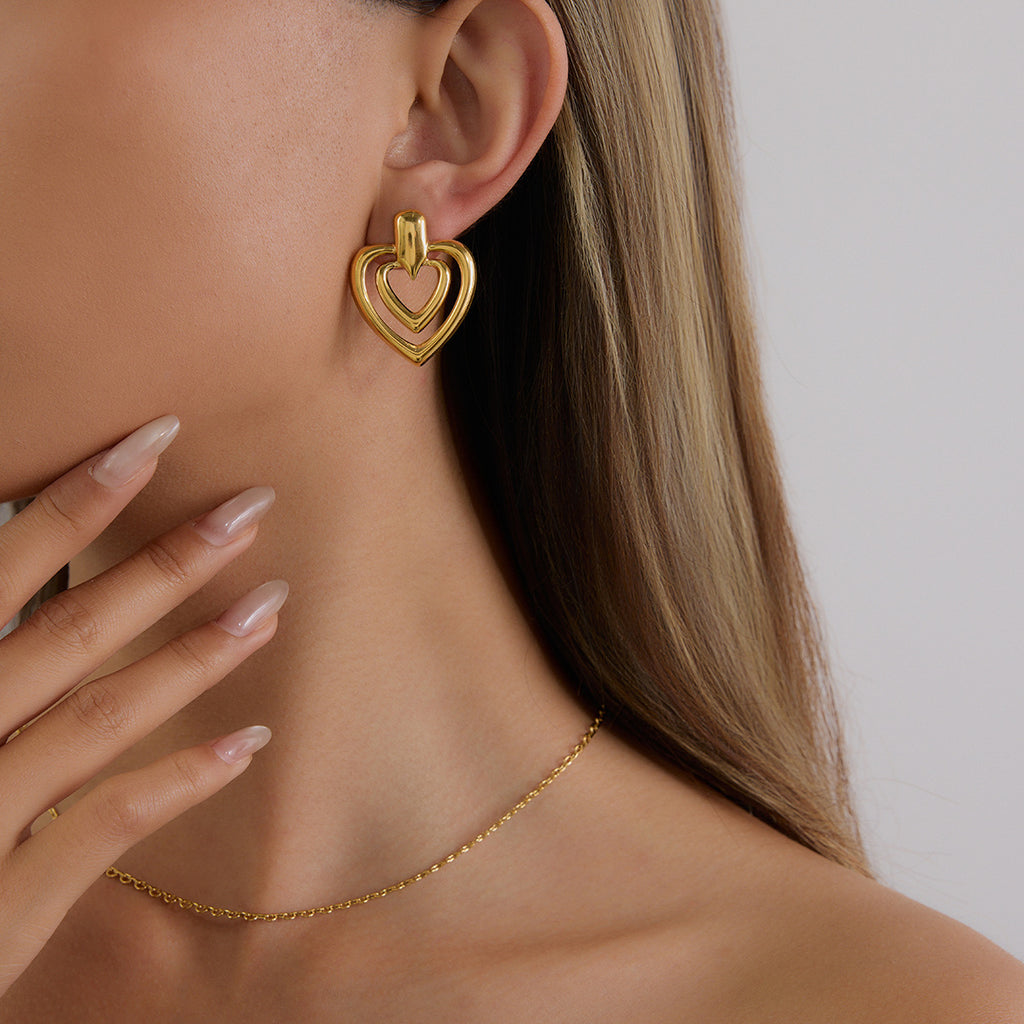 Golden stainless steel heart-shaped perforated earrings