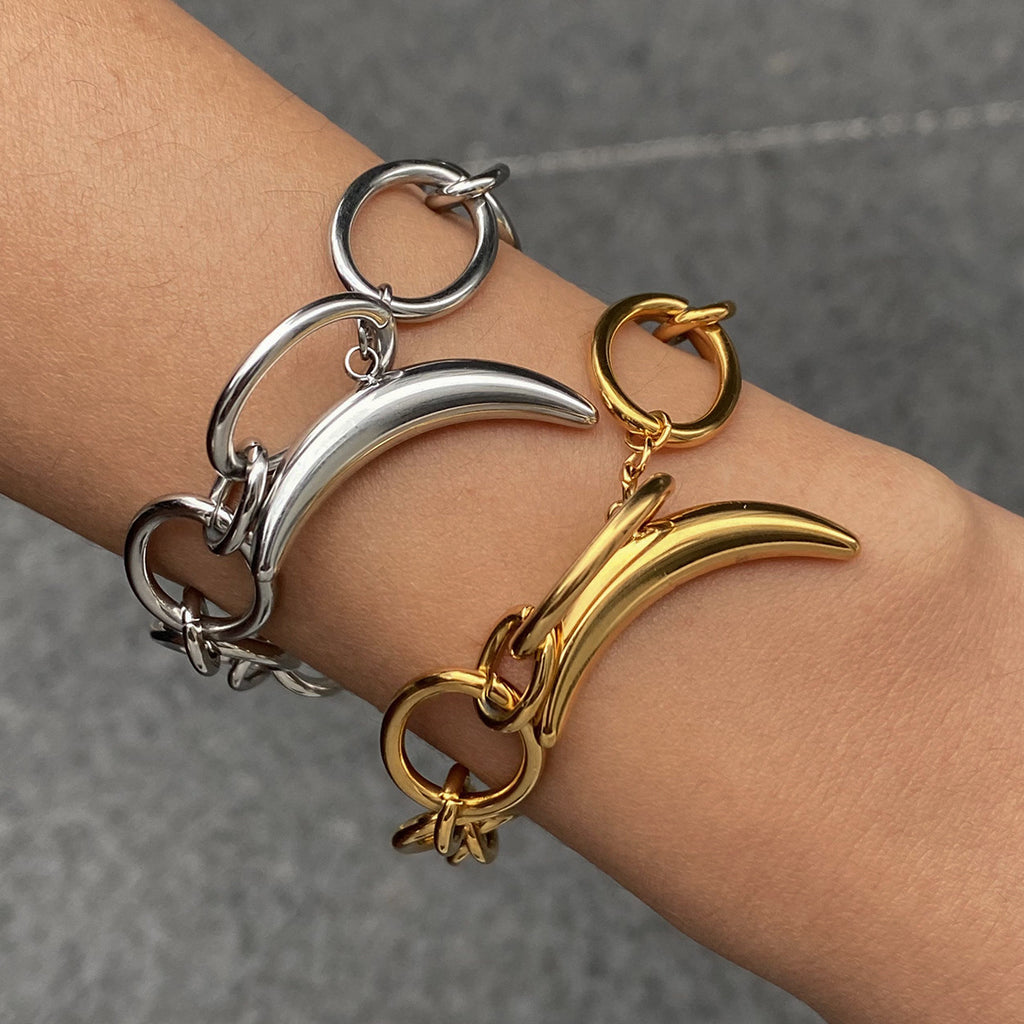 Golden, steel-colored stainless steel moon bracelet