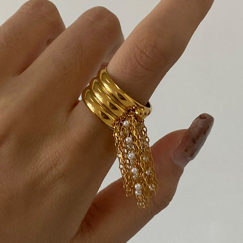 A golden stainless steel tassel open ring