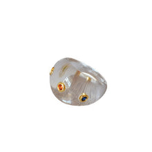 Load image into Gallery viewer, A transparent resin ring set with colored zircon