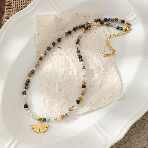 A hand-beaded necklace made of colored natural tourmaline