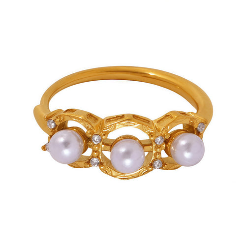 A golden stainless steel ring set with pearls
