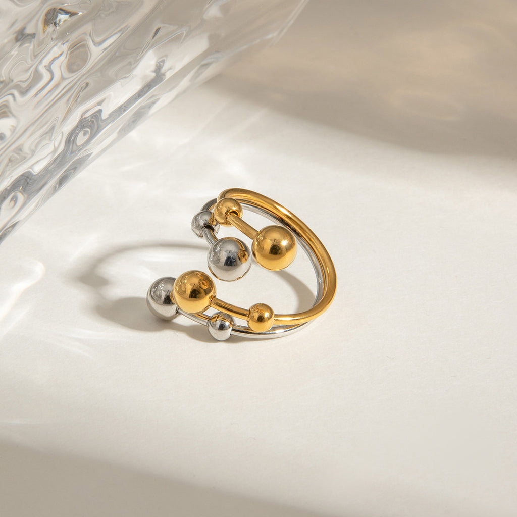 A double-layer ring made of stainless steel, gold and silver, with large and small steel balls