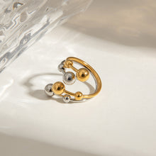 Load image into Gallery viewer, A double-layer ring made of stainless steel, gold and silver, with large and small steel balls
