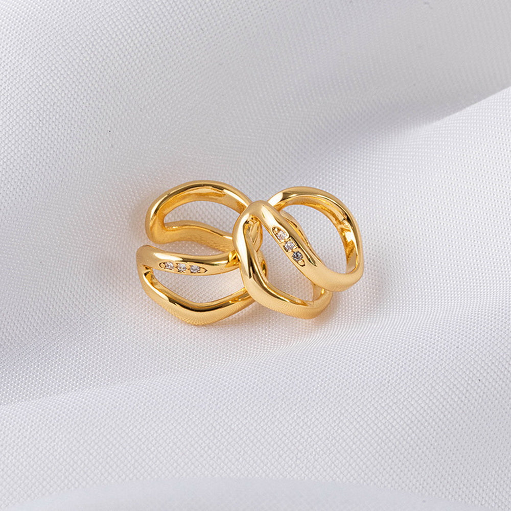 Irregular ear bone clips plated with real gold and studded with diamonds