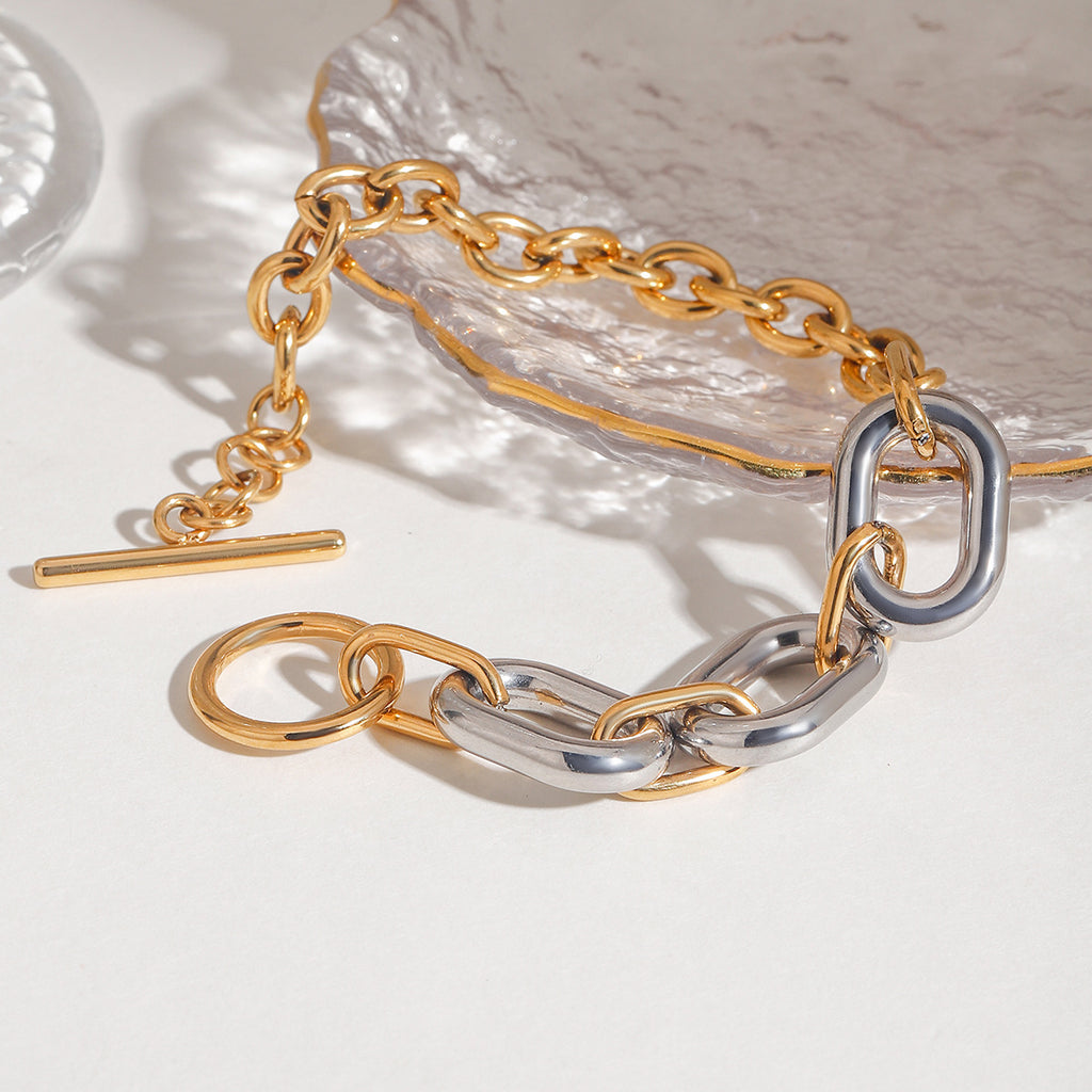 Stainless steel, gold and silver color-matched chain, oval smooth surface, hollowed-out circular OT buckle bracelet