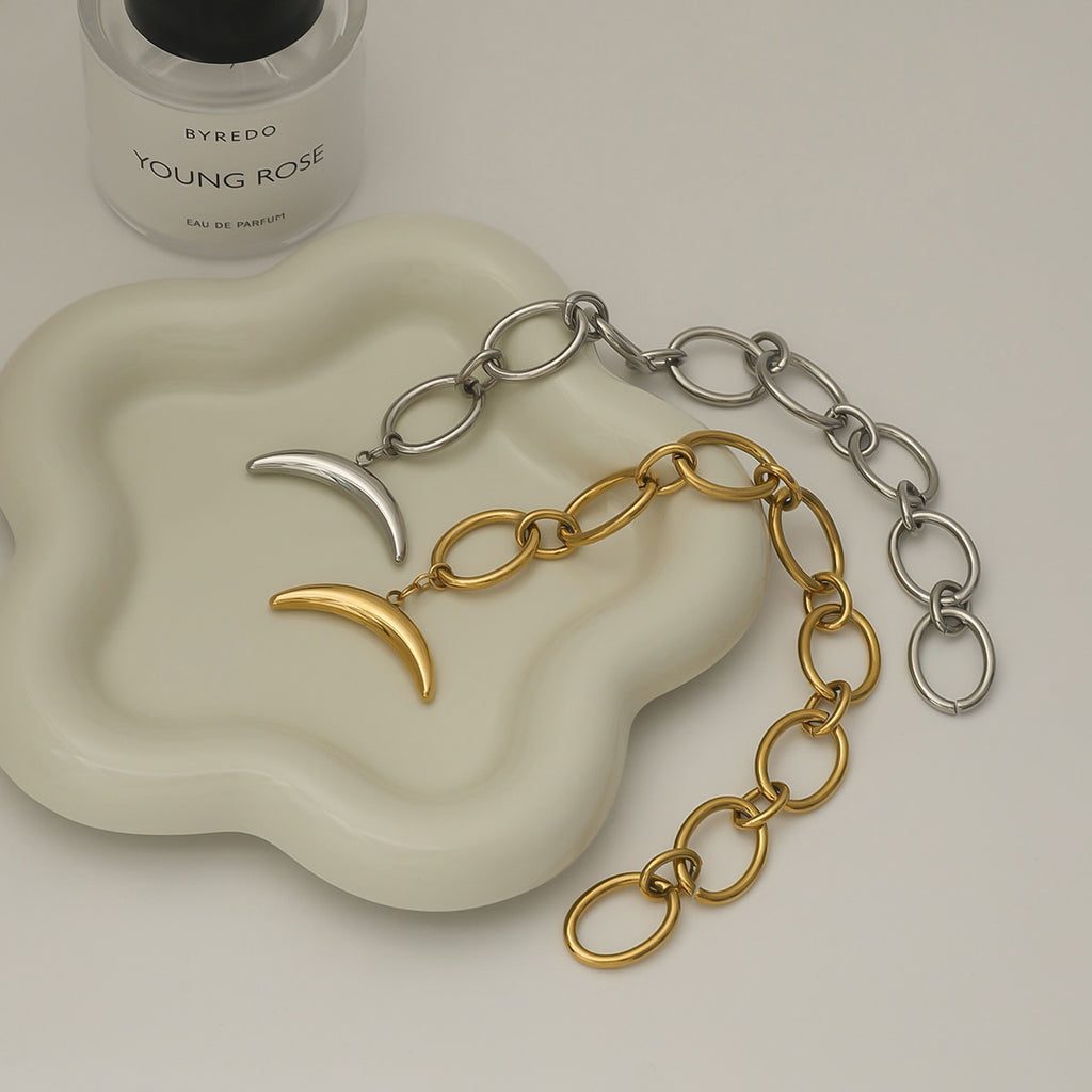 Golden, steel-colored stainless steel moon bracelet
