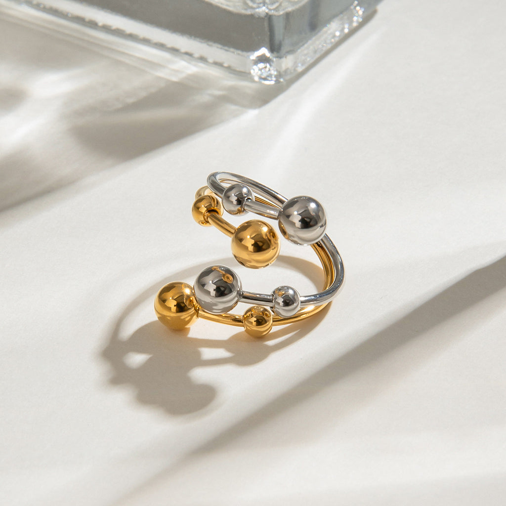 A double-layer ring made of stainless steel, gold and silver, with large and small steel balls
