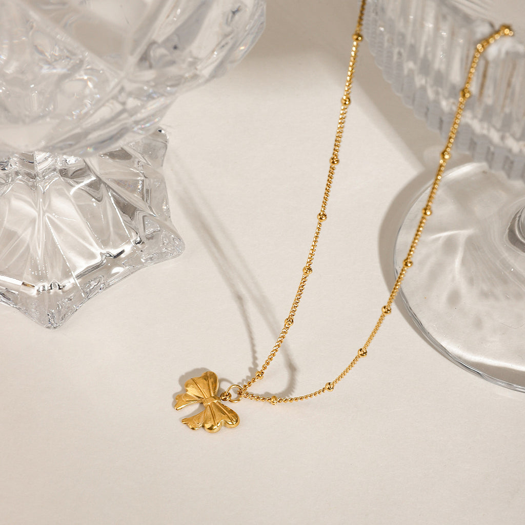 Stainless steel bow pendant necklace