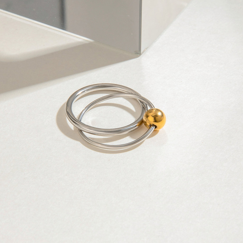 A stainless steel gold and silver color-matched double-ring ring