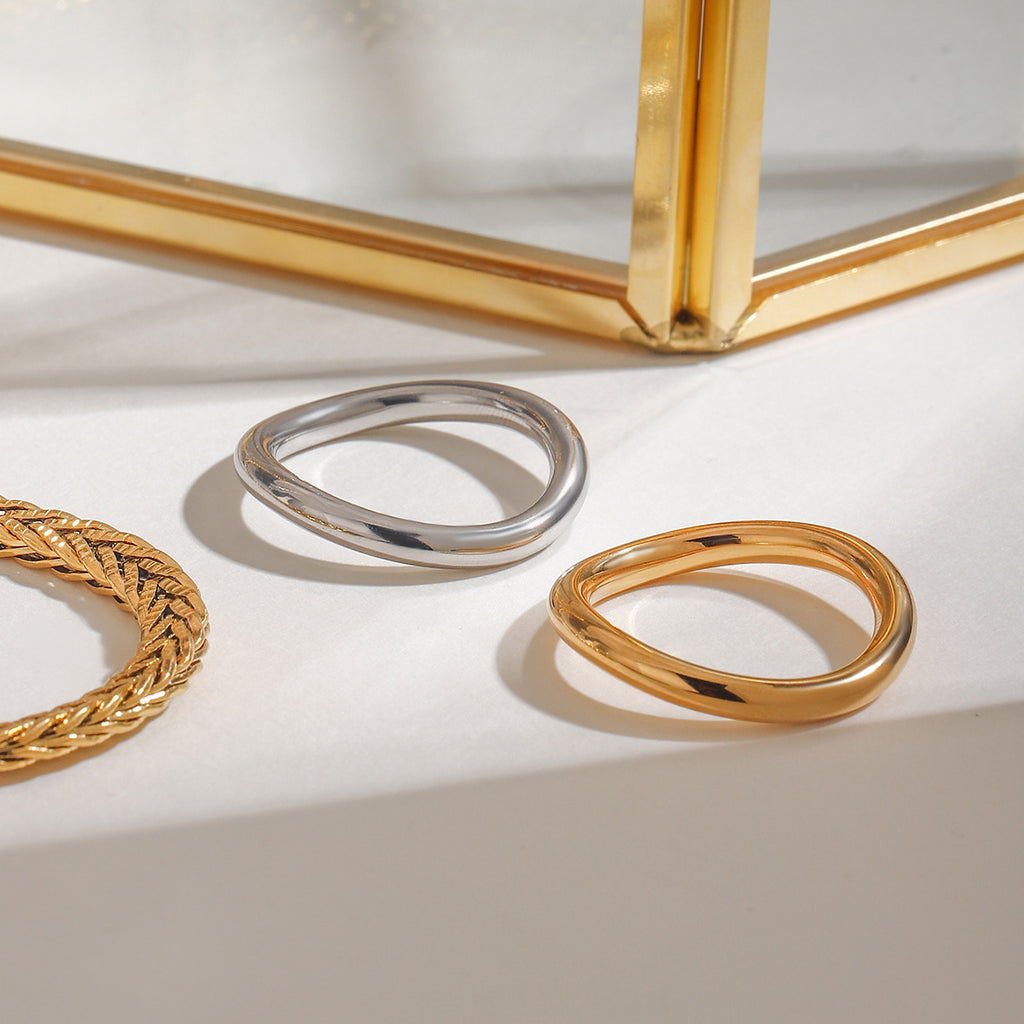 A 2-piece set of stainless steel rings in golden steel color