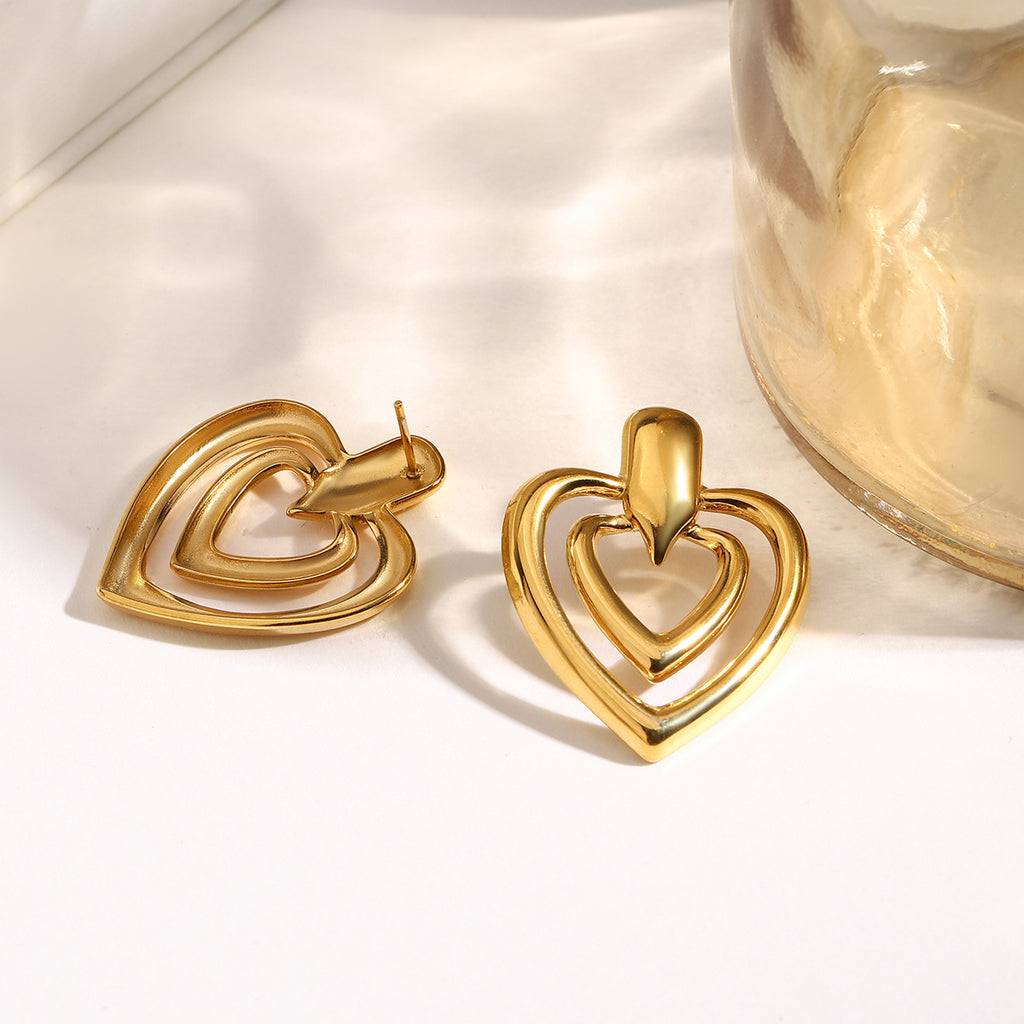 Golden stainless steel heart-shaped perforated earrings
