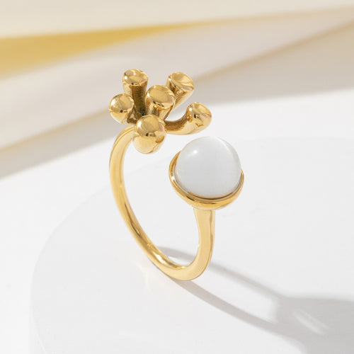 Stainless steel flowers adorn the cat's eye opening ring