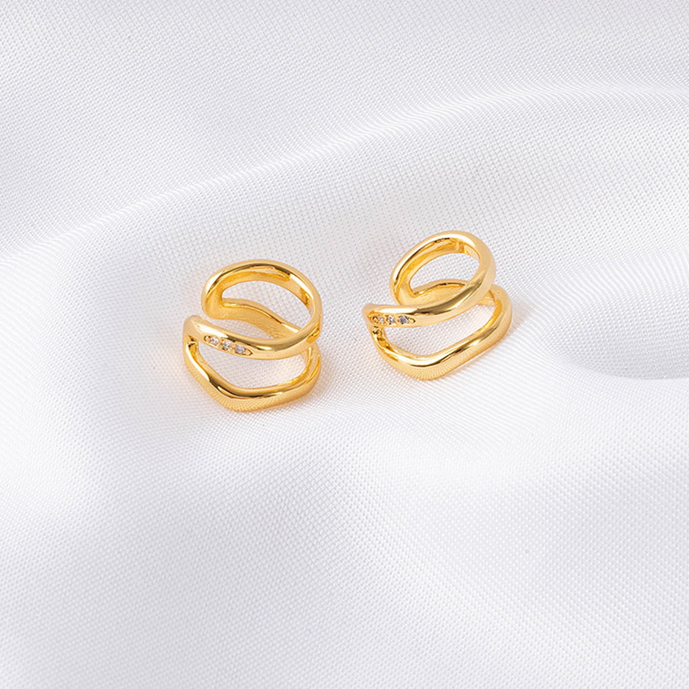 Irregular ear bone clips plated with real gold and studded with diamonds