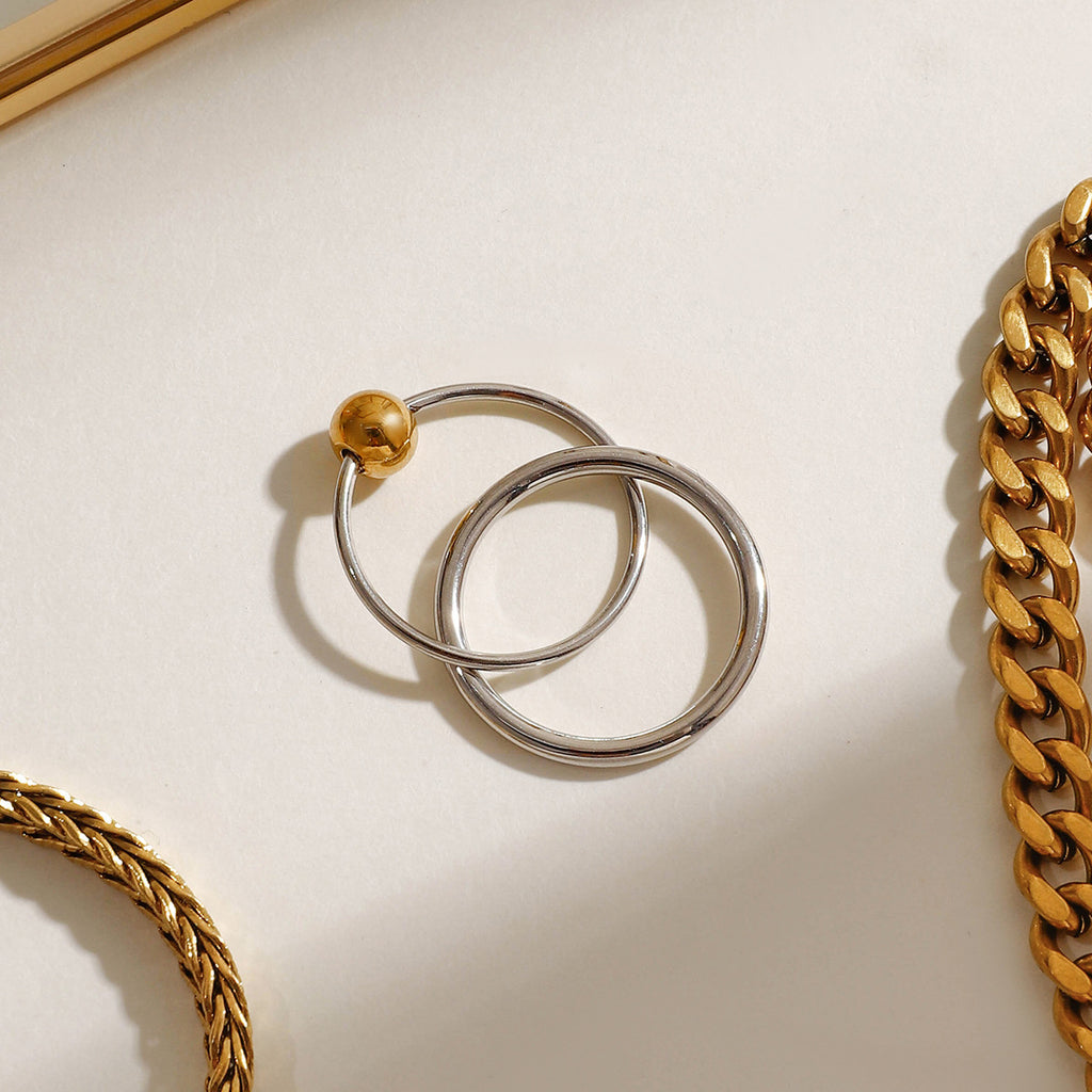 A stainless steel gold and silver color-matched double-ring ring