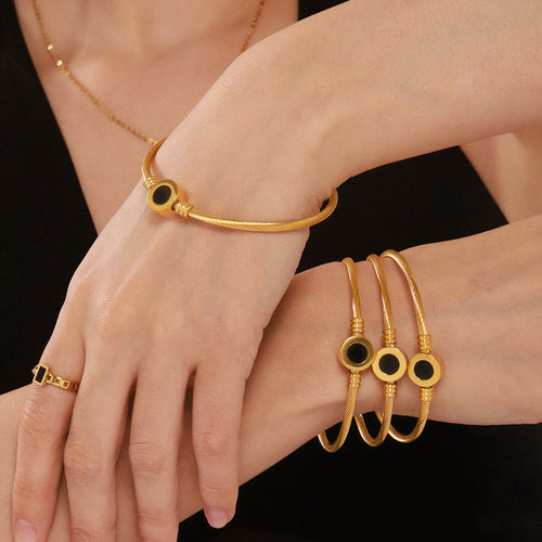 Golden stainless steel natural mother-of-pearl black elastic bracelet