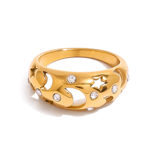 A stainless steel ring with diamond-encrusted and hollowed-out stars and moons