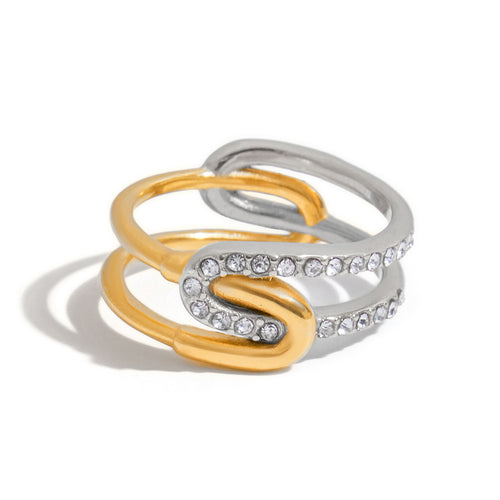A stainless steel gold and silver color-matched rhinestone ring