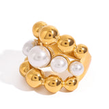 A golden stainless steel pearl round bead three-layer ring