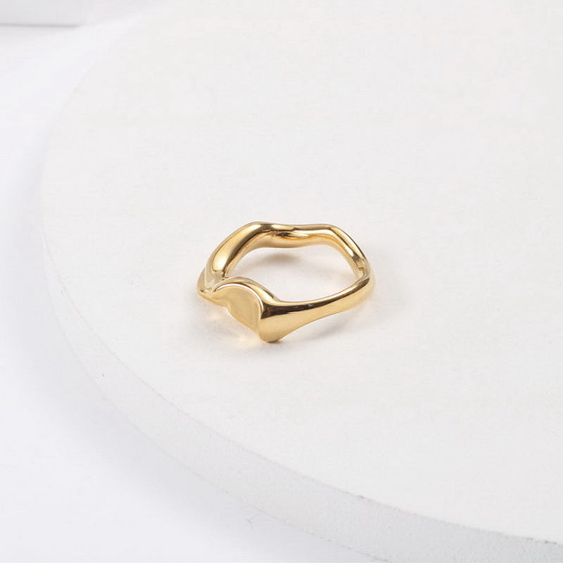 A golden stainless steel design abstract irregular-shaped ring