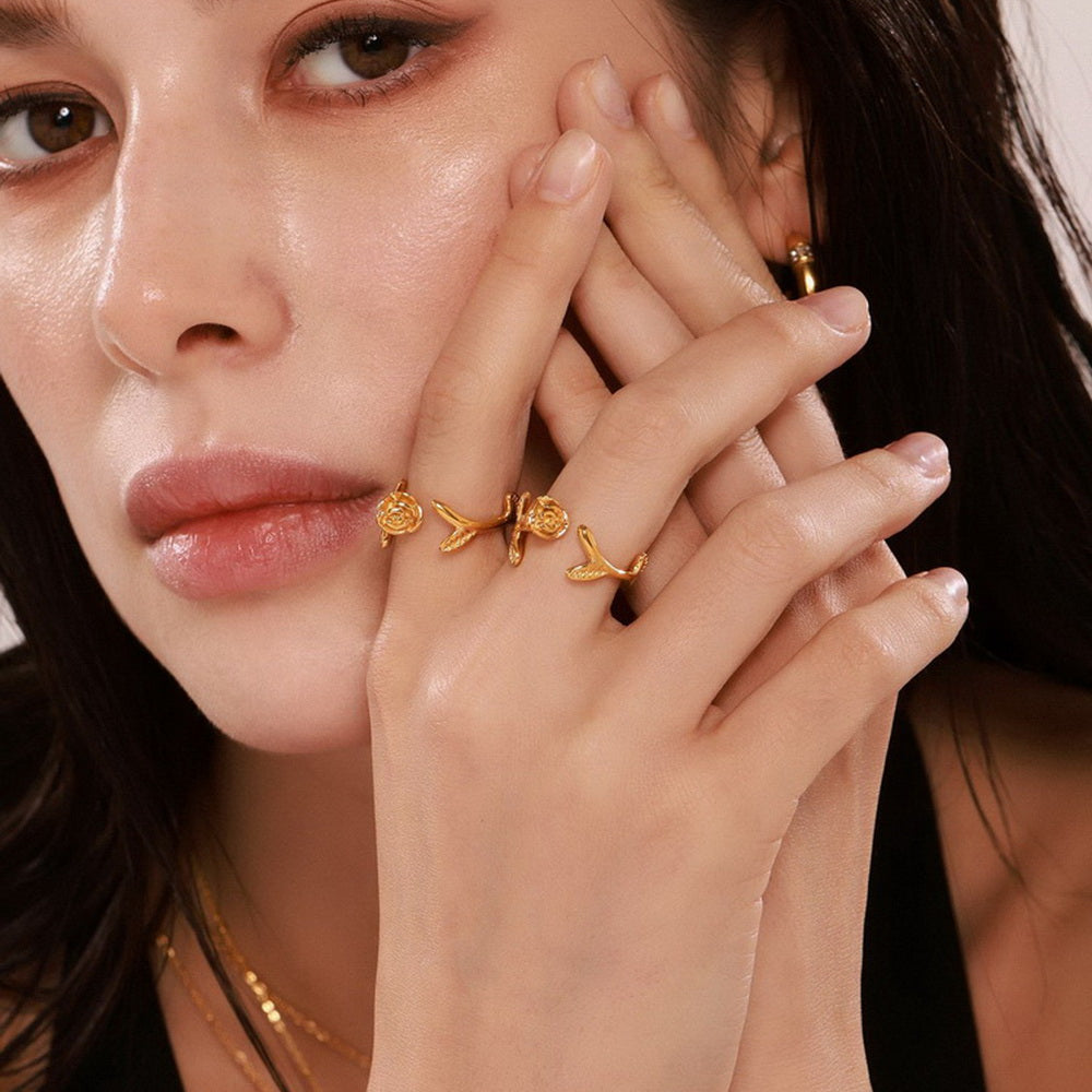A golden stainless steel three-dimensional rose flower opening ring